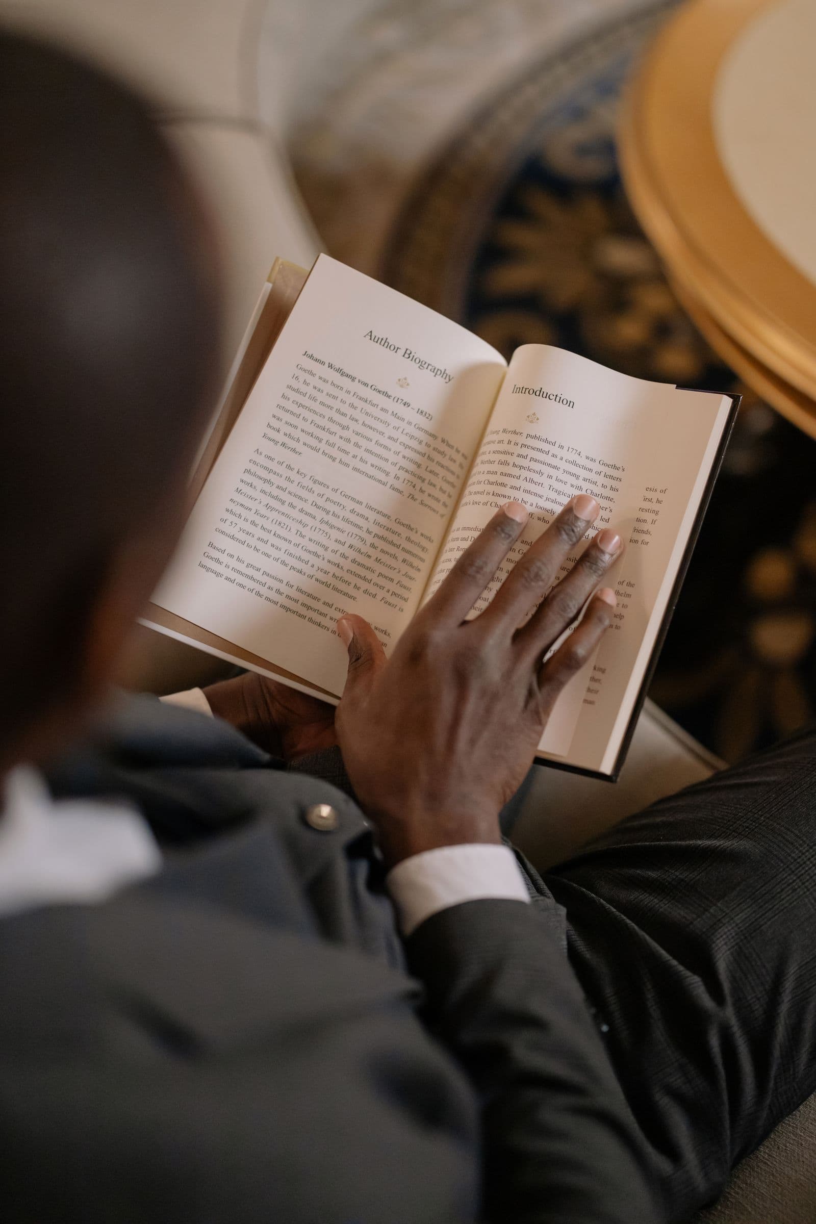 An open book in a reader’s hands